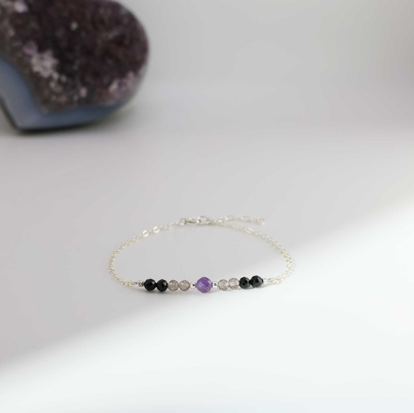 Dainty sterling silver empath protection bracelet with amethyst in the center, followed by 2 gold filled balls, amethyst and black tourmaline. These healing crystals is the perfect combination for empaths to help them shield and protect their energy.