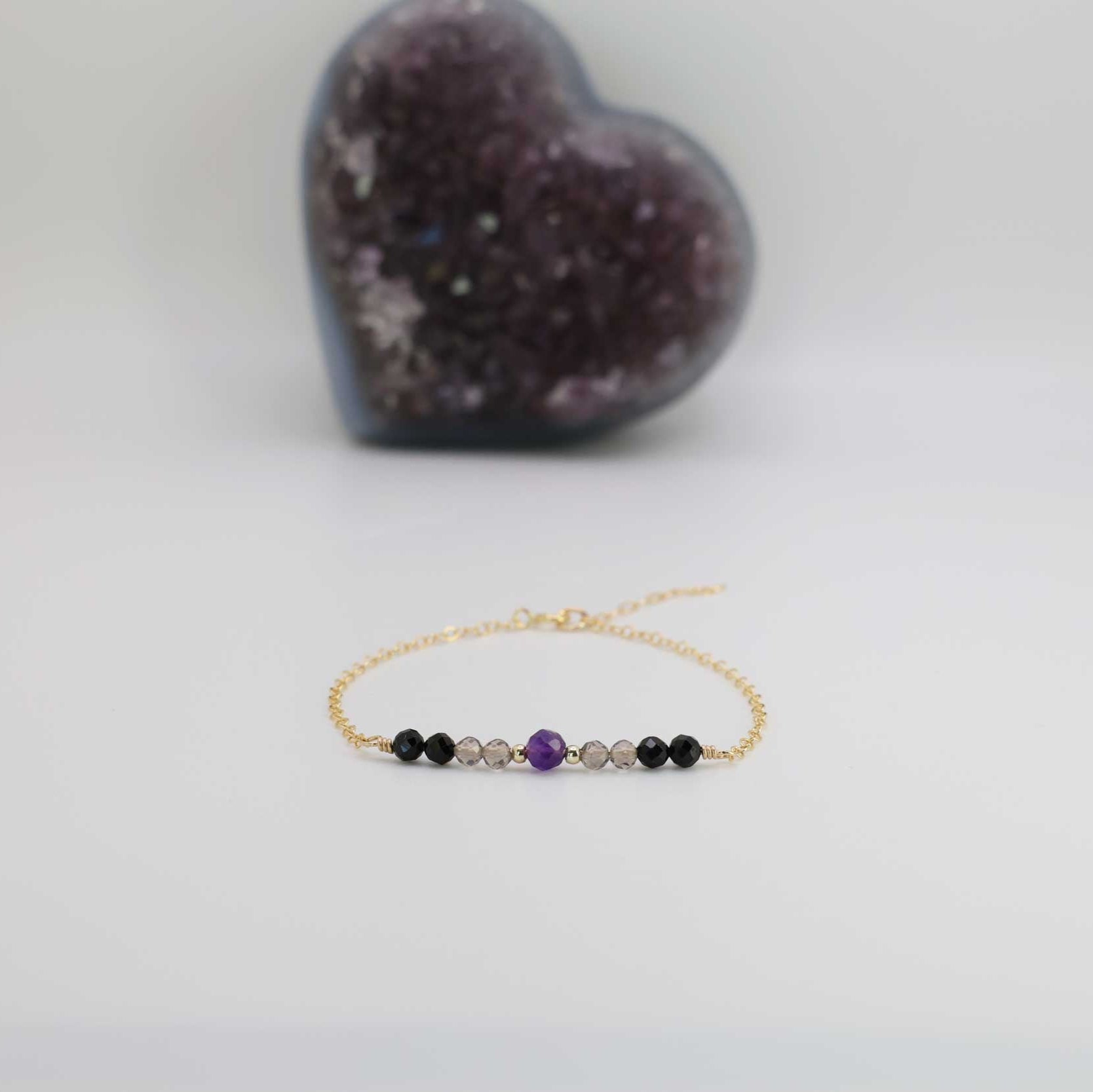 The Empath Protection Bracelet is designed to block negative energy and provide healing benefits. This healing crystal bracelet features a selection of powerful stones, including amethyst, smoky quartz, and black tourmaline, known for their protective and deflective properties against bad energy. 
Available in rose gold-filled, yellow gold-filled, or sterling silver options, this dainty bracelet is handcrafted and infused with the energy of healing crystals.