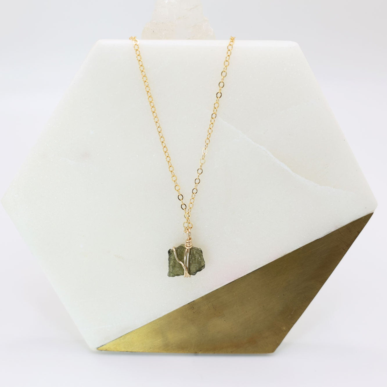 Moldavite pendant wrapped in 14k gold filled wire with a delicate 14k gold filled chain.