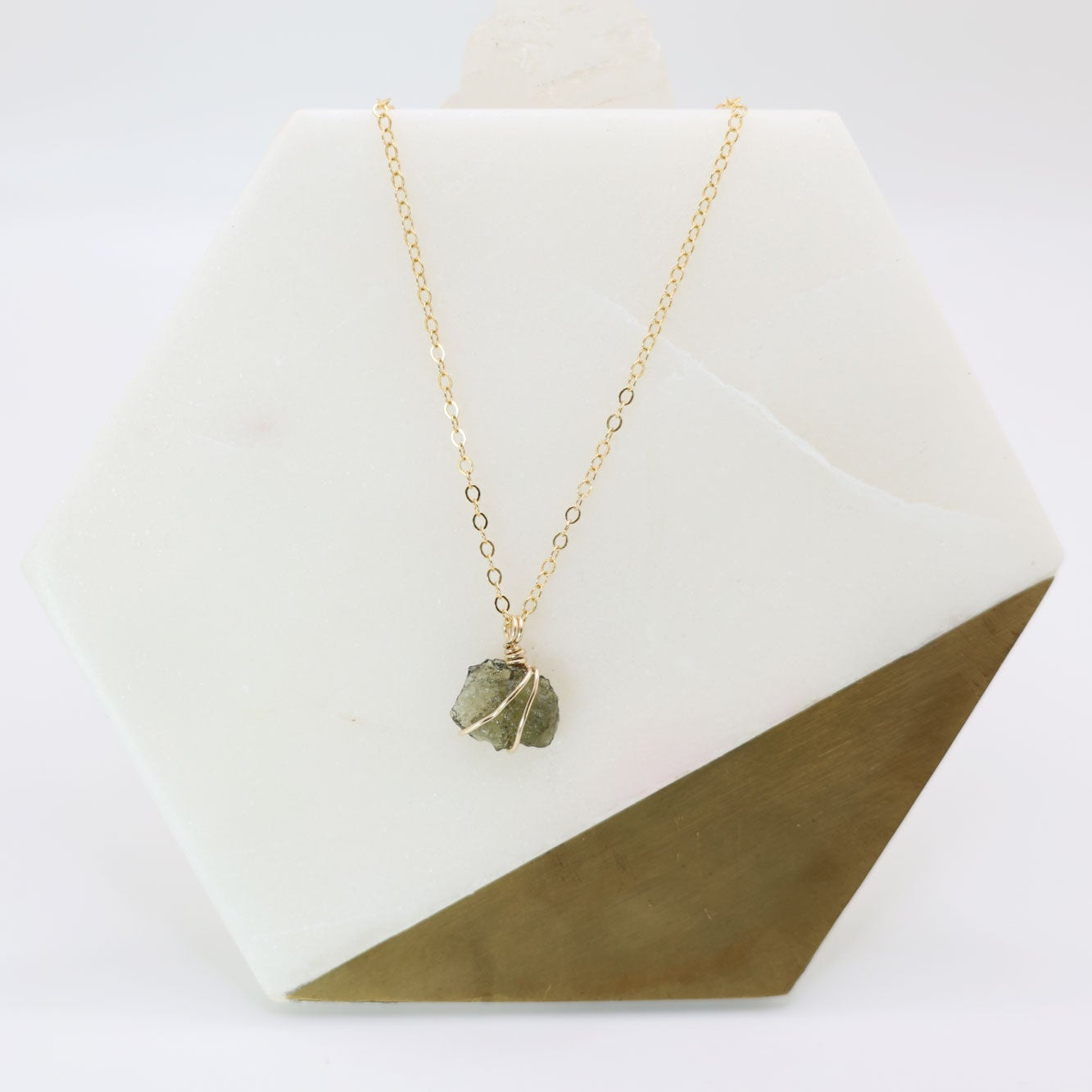 14k gold filled wire wrapped moldavite pendant with a delicate 14k gold filled chain.