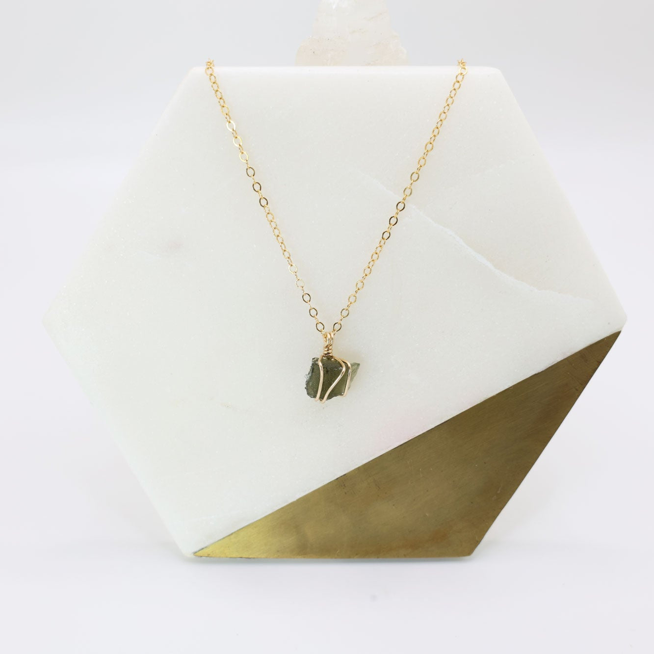 Authentic moldavite pendant wrapped in 14k gold filled wire and a delicate gold filled chain necklace.