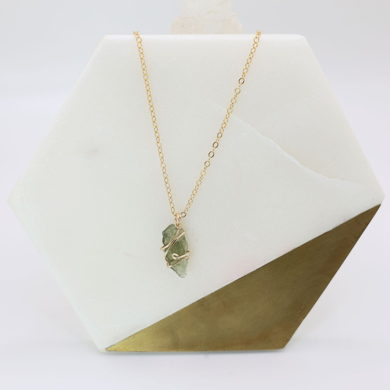 14k gold filled wire wrapped moldavite pendant with a delicate 14k gold filled chain.
