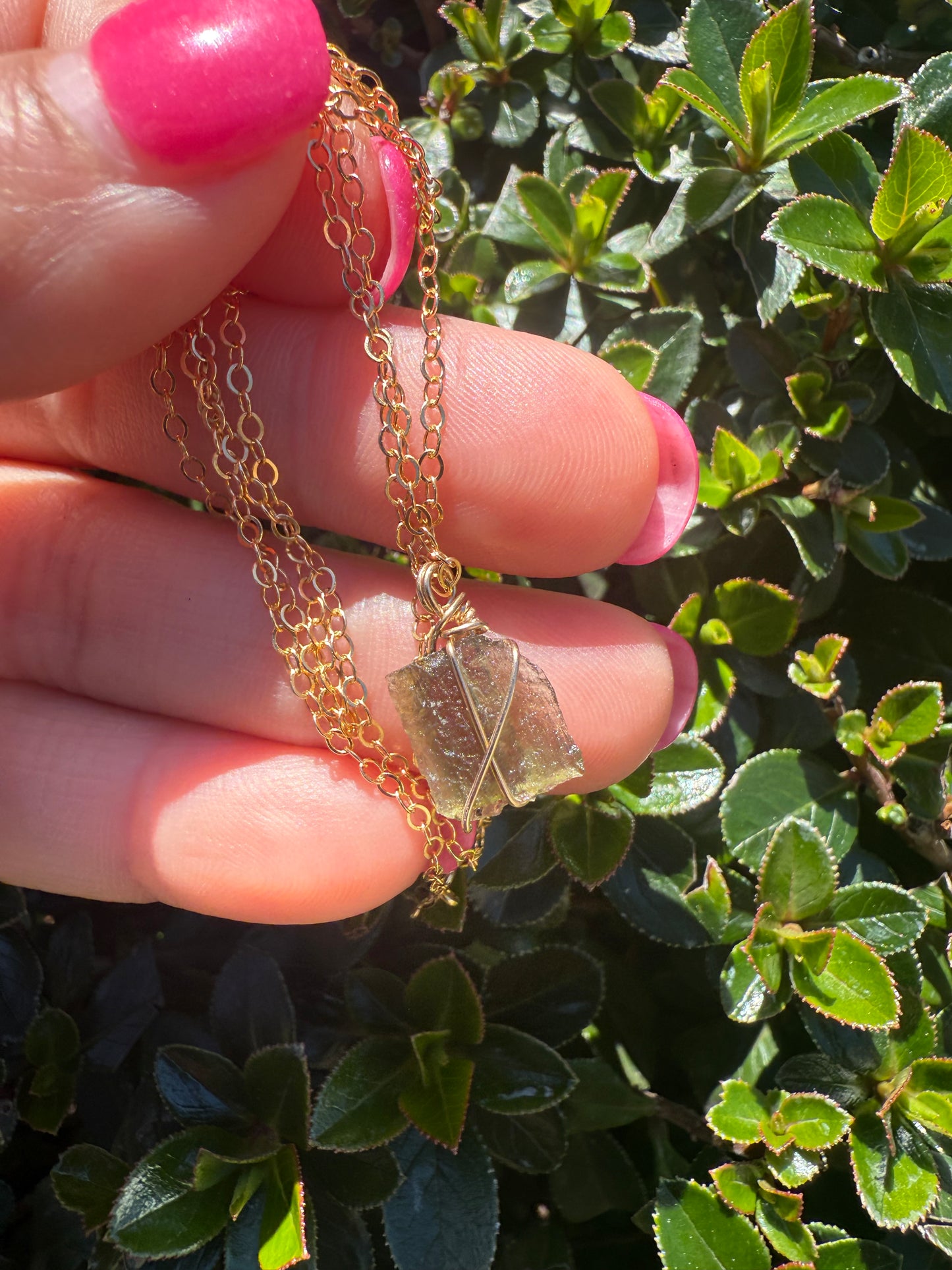 14k gold filled wire wrapped moldavite pendant with a delicate 14k gold filled chain.