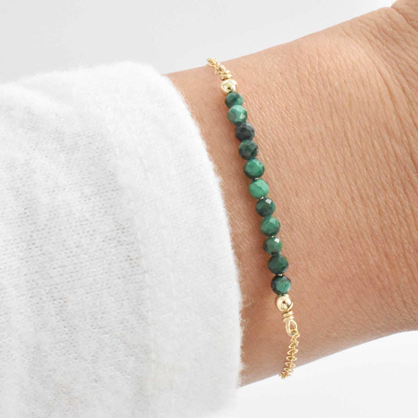 Dainty green malachite crystal bracelet with gold filled chain and gold filled beads at the end.