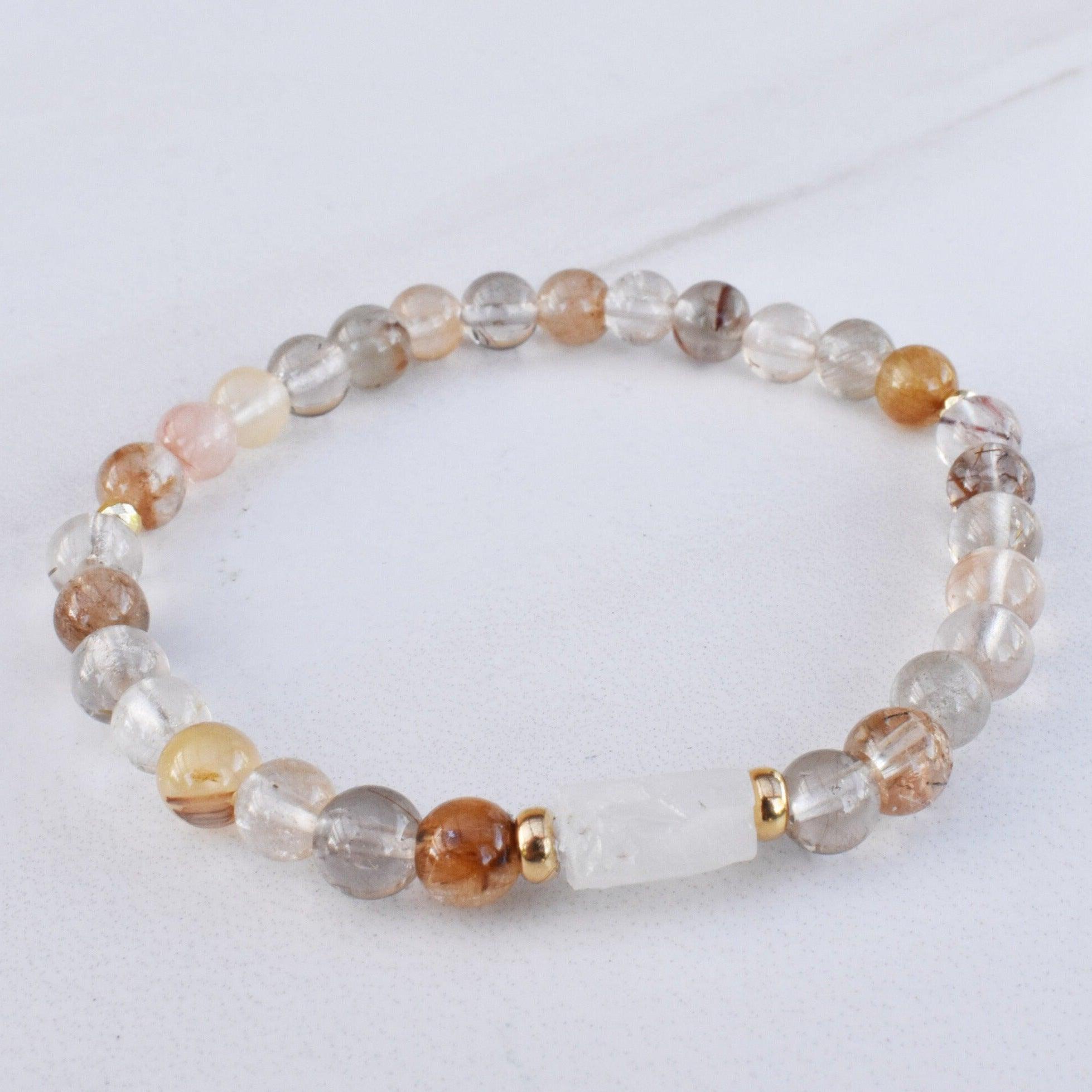 Rutilated Quartz and Moonstone healing Gemstone bracelet to help you manifest your dreams and make them a reality.