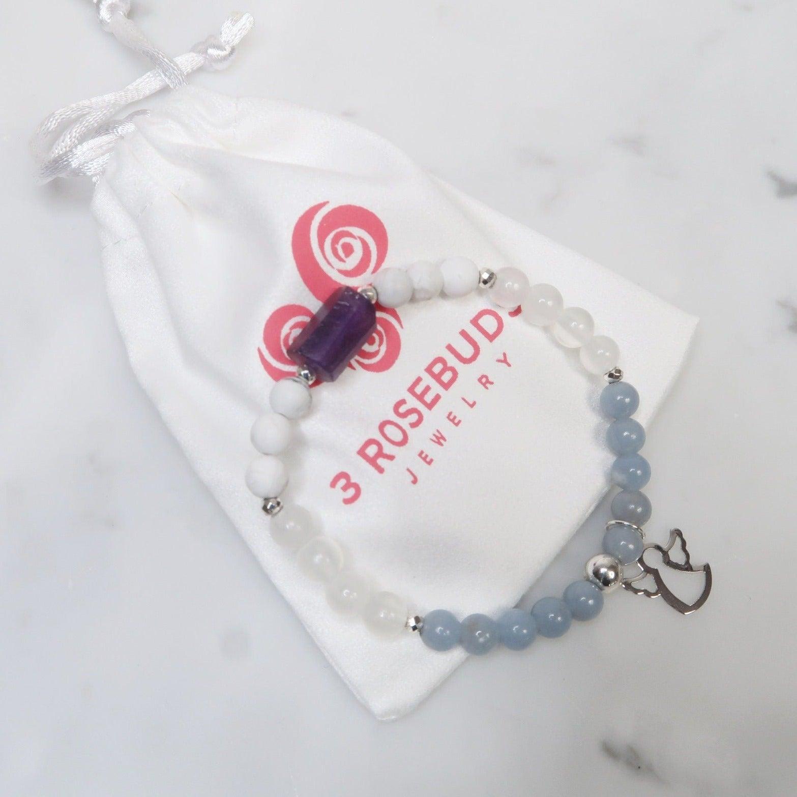 Reiki Infused Healing Gemstone Bracelet to Help you Connect with Your Angels & Guides. Featuring Amethyst, Angelite, Selenite, Howlite and an Angelic Charm to remind you that your team is always by your side. 