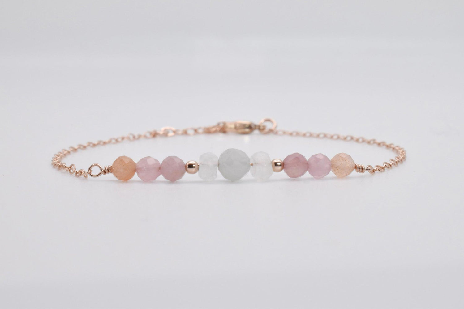 Rose gold fertility crystal jewelry, handcrafted with the best fertility crystals such as moonstone, rose quartz, and aquamarine. 