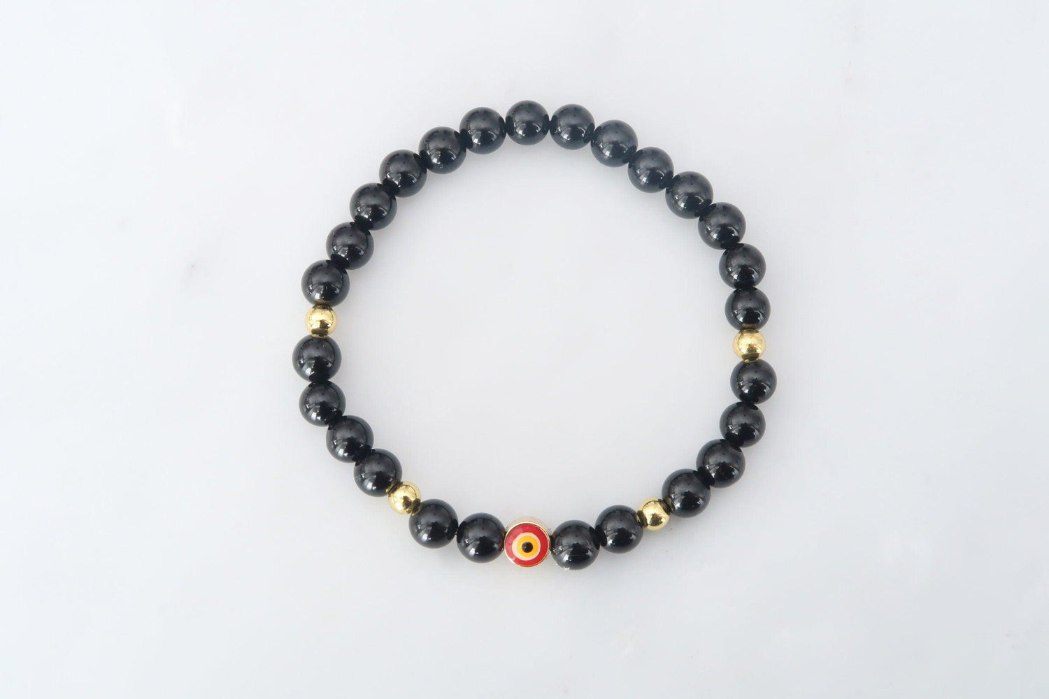 Evil eye protection bracelet featuring an evil eye bead amulet and black tourmaline crystals to deflect any negative energy from coming your way. 