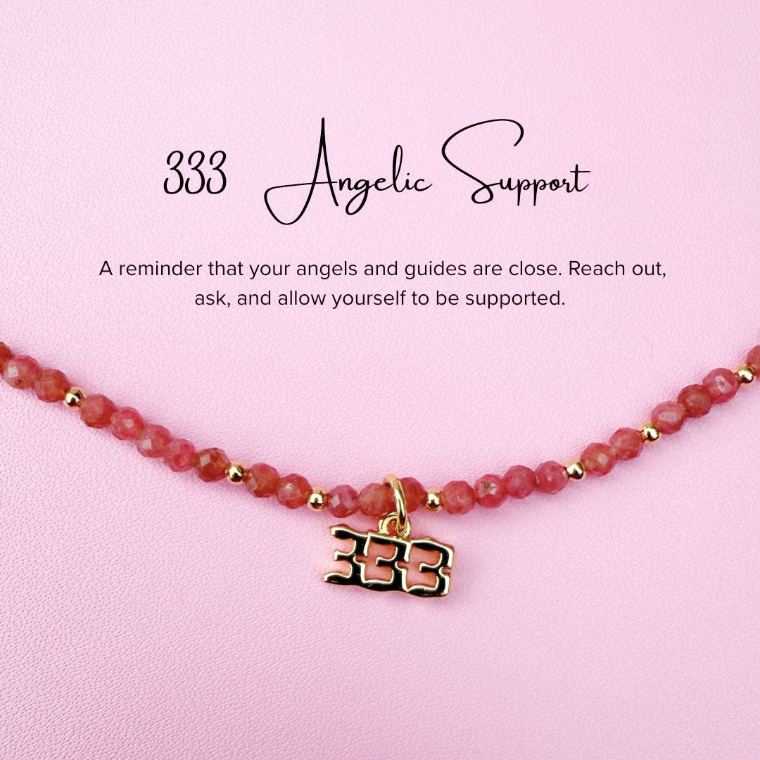 Pink tourmaline Necklace with '333' angel number charm on a pink background with text about angelic support.