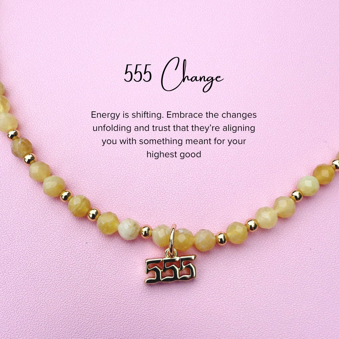 Yello Opal Necklace with a '555' angel number charm on a pink background with motivational text.