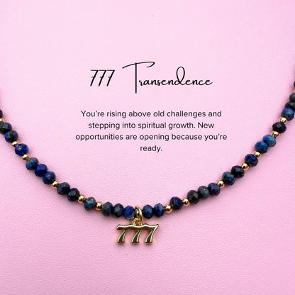 Blue lapiz lazuli Necklace with angel '777' charm on a pink background