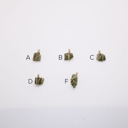 Raw Moldavite selection of wire wrapped pendants wrapped in 14k gold filled. 
