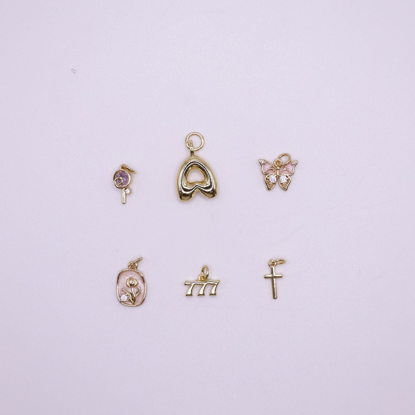 Set of gold charms on a  white background
