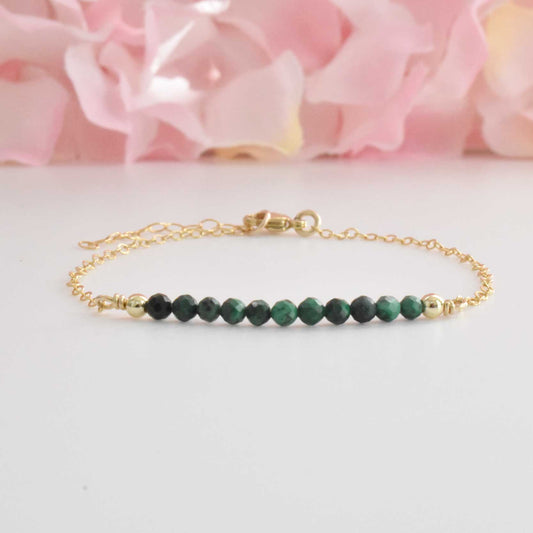 Dainty gold filled malachite crystal bracelet. Features green malachite healing crystals