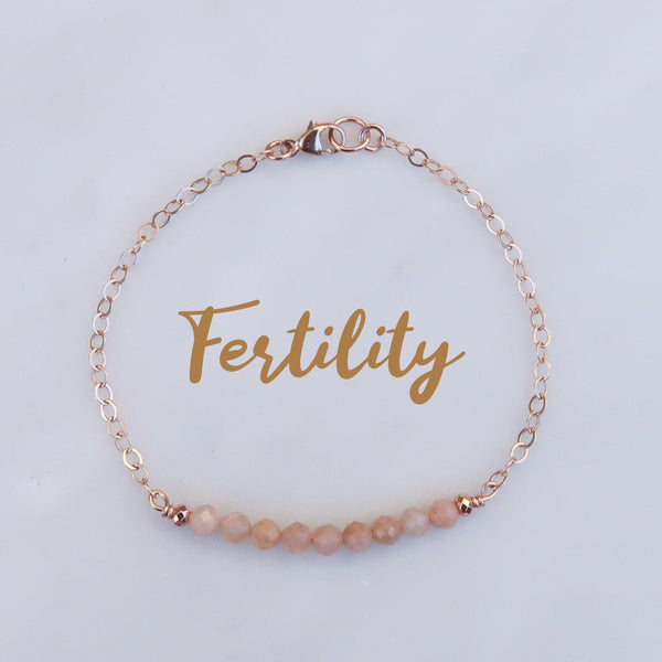 Dainty fertility peach moonstone healing bracelet.  Featuring a rose gold filled  chain and 3 mm peach moonstone crystal gemstones. 