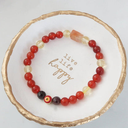 Phoenix Rising with evil eye protection for Solar, Sacral, & Root Chakra Healing. Featuring Carnelian, Citrine, Sunstone, and Garne. Infused with Reiki Healing - 3Rosebudsco.com- 3Rosebudsco.com