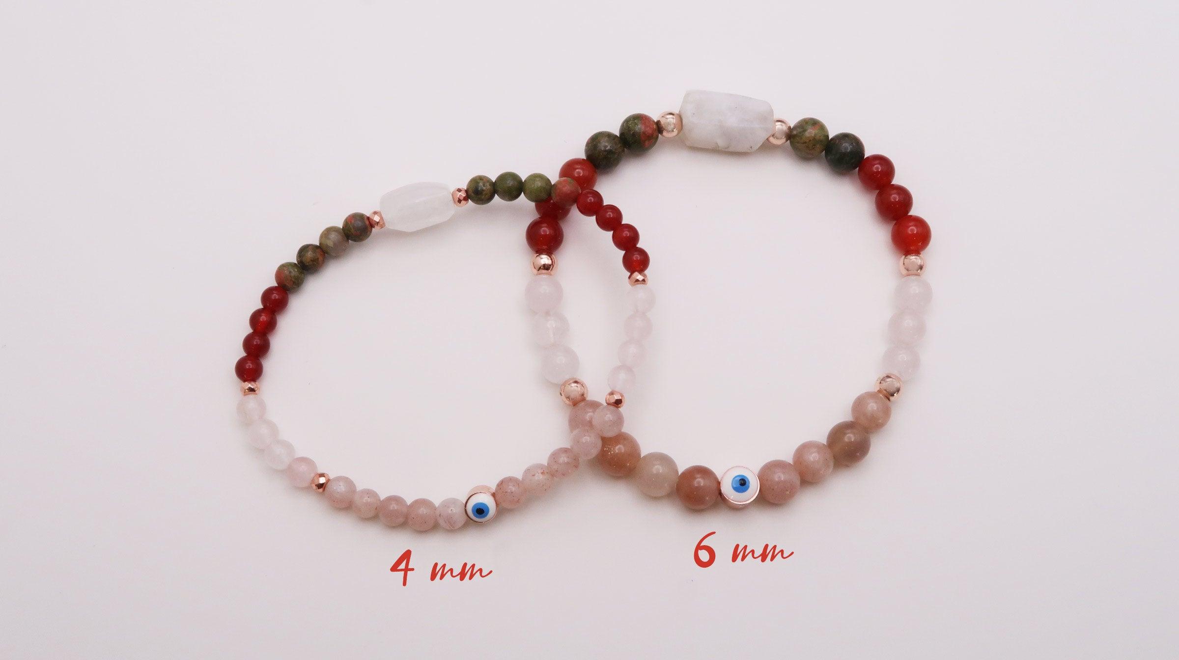Fertility Journey and Positive Pregnancy bracelet with peach moonstone, rainbow moonestone, carnelian, rose quarts and an evil eye bead for protection. 