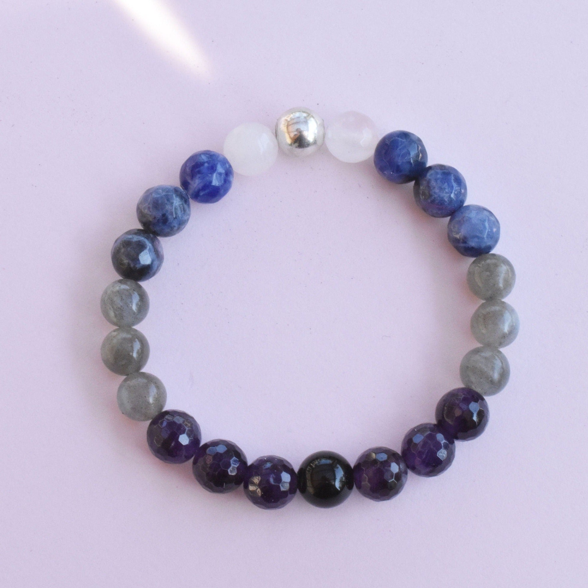 Awaken your psychic intuitive abilities with the power of healing crystal gemstones. This bracelet features sodalite, moonstone, labradorite, amethyst and black obsidian to help you on your development journey. 