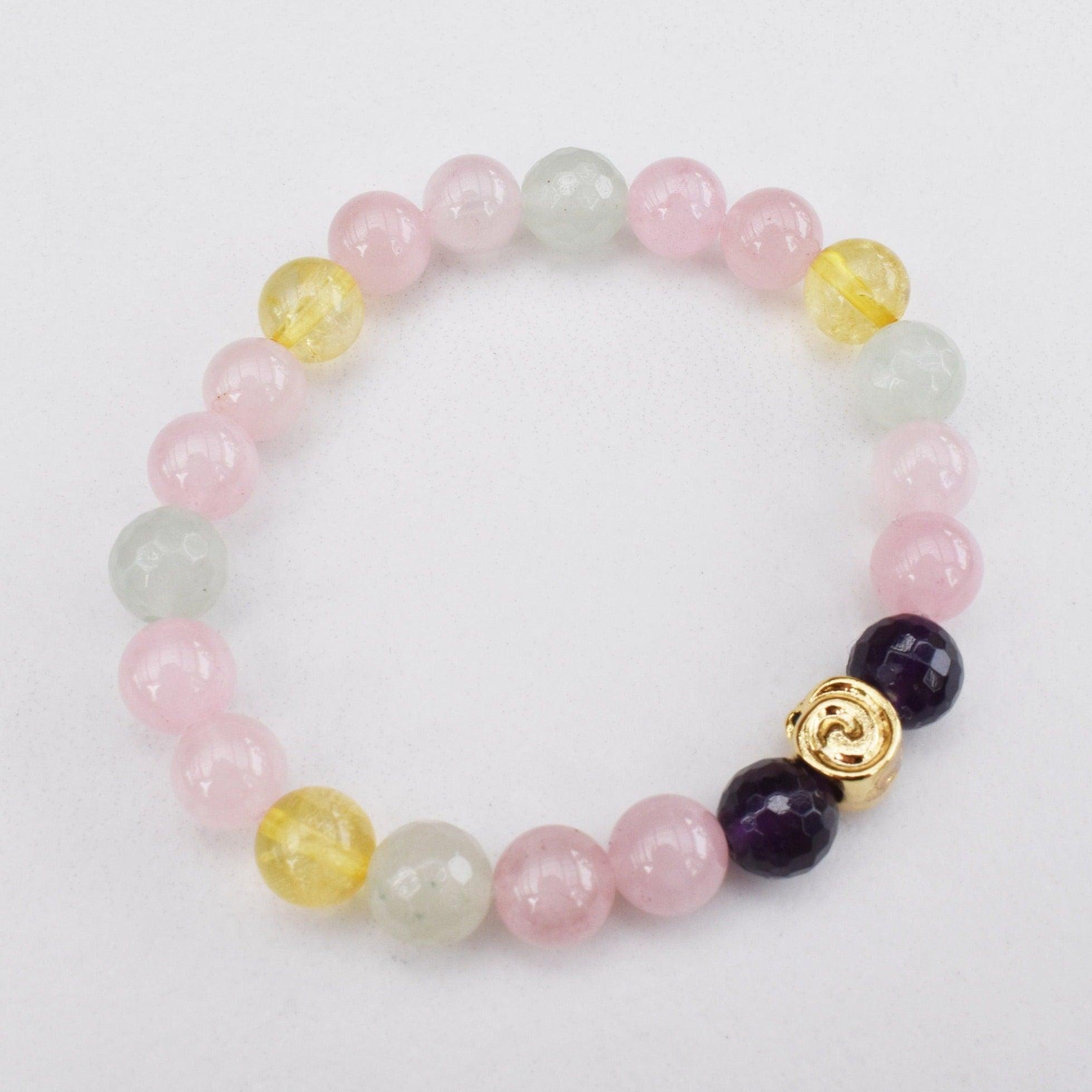 All covered healing gemstone bracelet featuring rose quartz, amethyst, citrine, and green aventurine. Reiki Infused Jewelry to help you bloom your intention. 